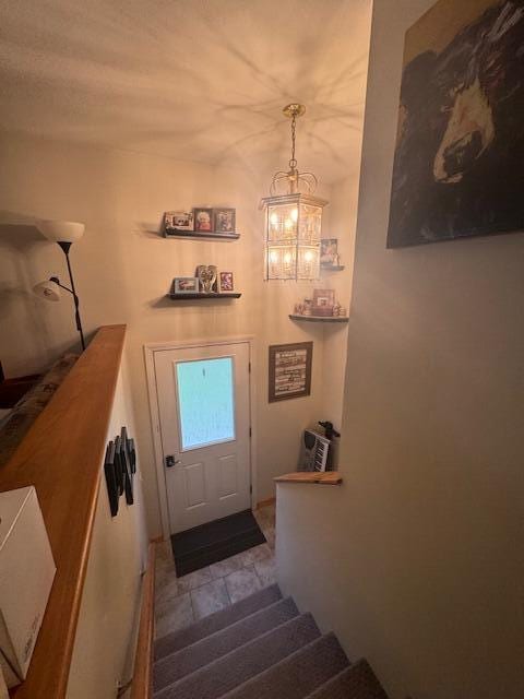 20 Oak Ridge Dr, Chelsea, ME 04330 - doorway featuring stairs and a chandelier