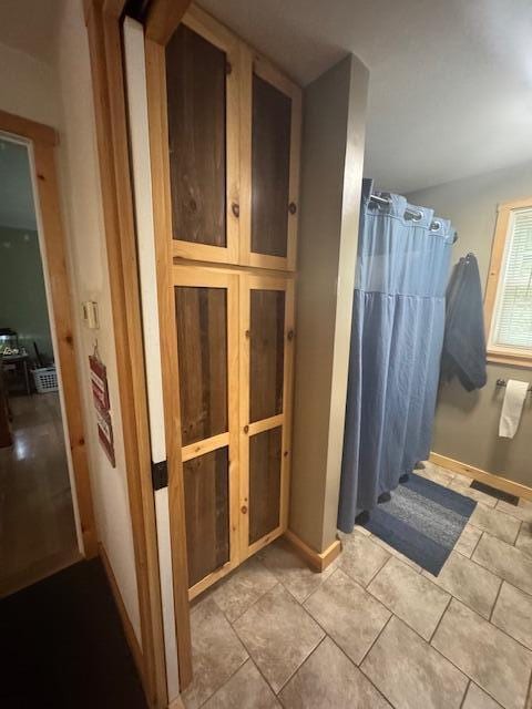 20 Oak Ridge Dr, Chelsea, ME 04330 - full bathroom featuring a shower with curtain, baseboards, and tile patterned floors