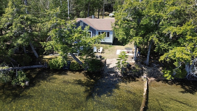 aerial view of property's location with a forest