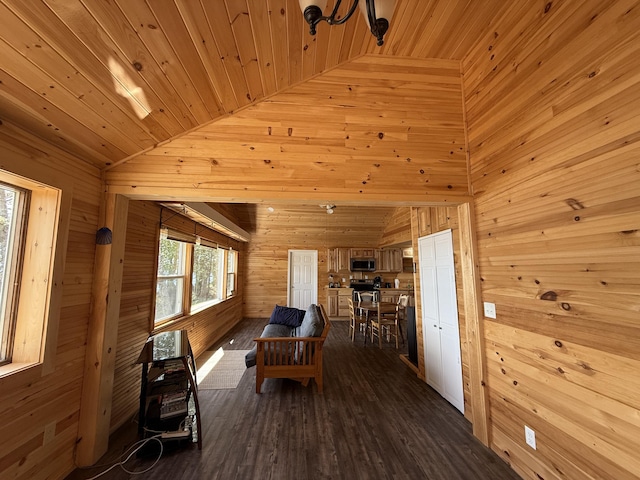 dining space featuring wood walls, wooden ceiling, lofted ceiling, and dark wood-style flooring