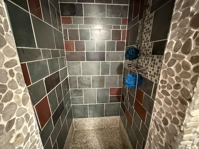 bathroom with tiled shower