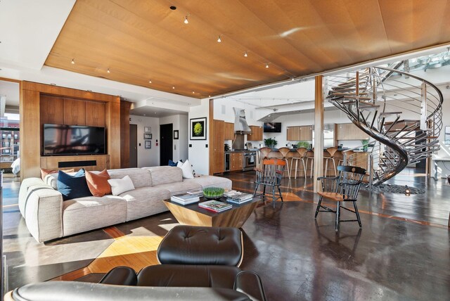 547 Congress St Unit 6, Portland, ME 04101 - living room with finished concrete flooring and stairway