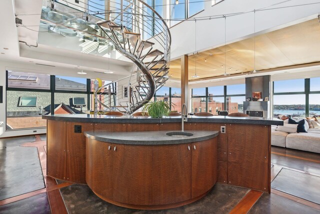 547 Congress St Unit 6, Portland, ME 04101 - bar featuring stairway, a towering ceiling, and a sink