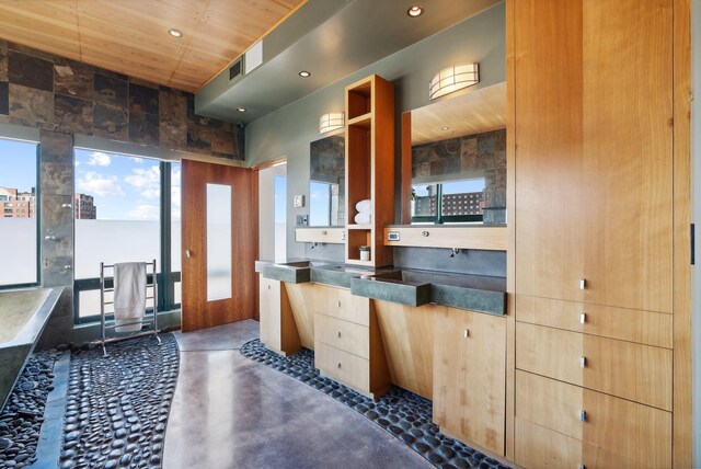 547 Congress St Unit 6, Portland, ME 04101 - bathroom featuring concrete flooring, vanity, and recessed lighting