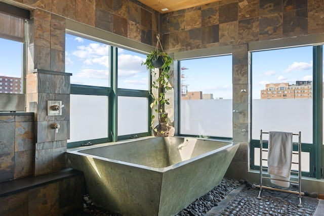 547 Congress St Unit 6, Portland, ME 04101 - full bathroom with a freestanding tub and plenty of natural light