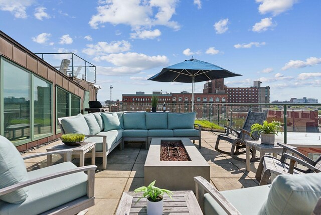 547 Congress St Unit 6, Portland, ME 04101 - view of patio / terrace featuring an outdoor living space with a fire pit and a view of city