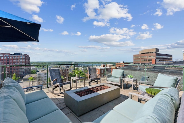 547 Congress St Unit 6, Portland, ME 04101 - view of patio featuring an outdoor living space with a fire pit and a city view