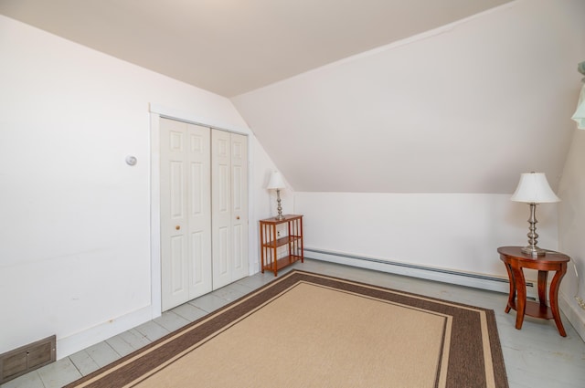 626 Wiscasset Rd, Pittston, ME 04345 - additional living space with baseboard heating, vaulted ceiling, and baseboards