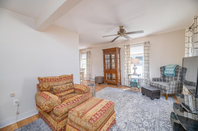 626 Wiscasset Rd, Pittston, ME 04345 - living room featuring ceiling fan, wood finished floors, baseboards, and beamed ceiling
