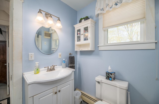 626 Wiscasset Rd, Pittston, ME 04345 - bathroom with vanity, a baseboard radiator, and toilet