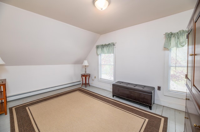 626 Wiscasset Rd, Pittston, ME 04345 - bedroom with a baseboard radiator, multiple windows, vaulted ceiling, and baseboards