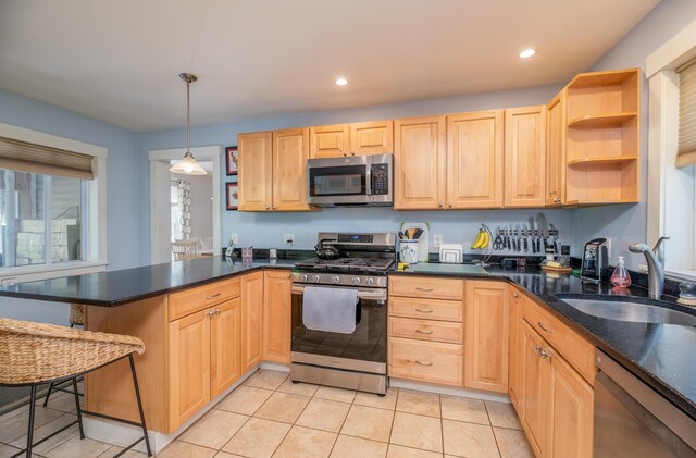 626 Wiscasset Rd, Pittston, ME 04345 - kitchen featuring appliances with stainless steel finishes, a peninsula, a sink, light brown cabinetry, and recessed lighting