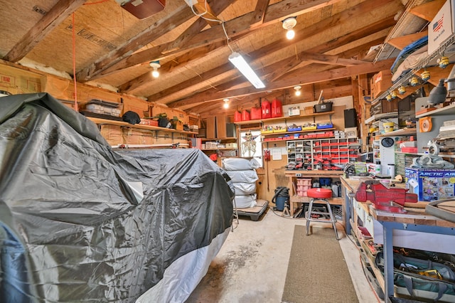 626 Wiscasset Rd, Pittston, ME 04345 - garage with a workshop area and a garage door opener