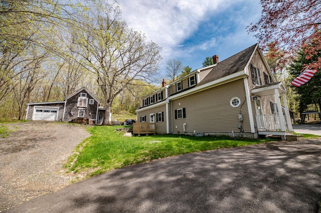 626 Wiscasset Rd, Pittston, ME 04345 - view of property exterior featuring a chimney, a lawn, and dirt driveway