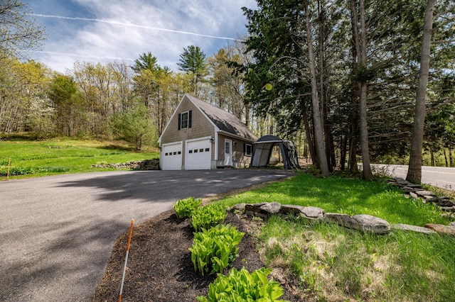 626 Wiscasset Rd, Pittston, ME 04345 - view of side of home featuring an outbuilding, a detached garage, and a yard