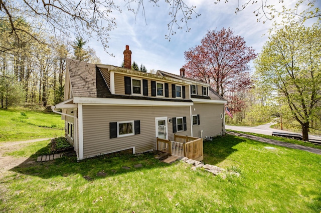 626 Wiscasset Rd, Pittston, ME 04345 - back of property featuring a lawn and a chimney