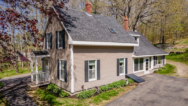 626 Wiscasset Rd, Pittston, ME 04345 - view of front of house with a chimney and roof with shingles