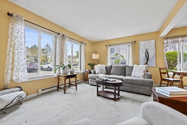 18 Ocean St Unit 72, South Portland, ME 04106 - living area featuring baseboard heating, a textured ceiling, carpet floors, and baseboards