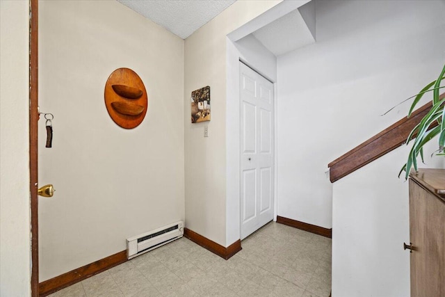 18 Ocean St Unit 72, South Portland, ME 04106 - hallway with baseboard heating, baseboards, and light flooring