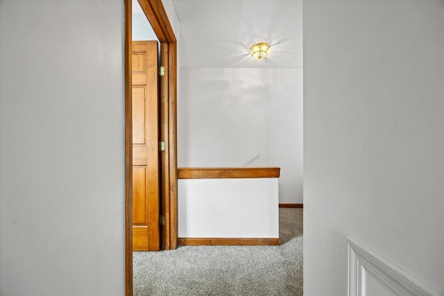 18 Ocean St Unit 72, South Portland, ME 04106 - hall with carpet flooring, an upstairs landing, and a textured ceiling