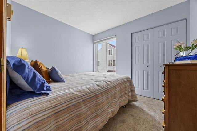 18 Ocean St Unit 72, South Portland, ME 04106 - bedroom featuring carpet flooring, a closet, and a textured ceiling