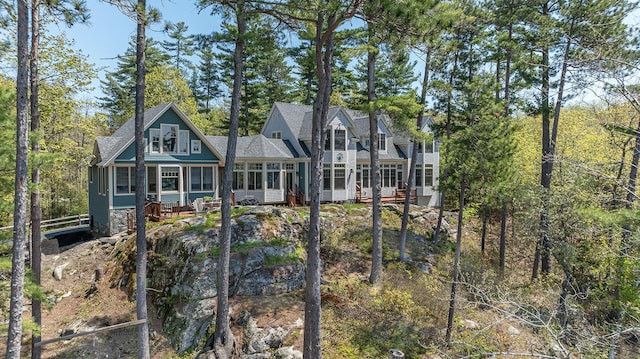 back of house with a sunroom