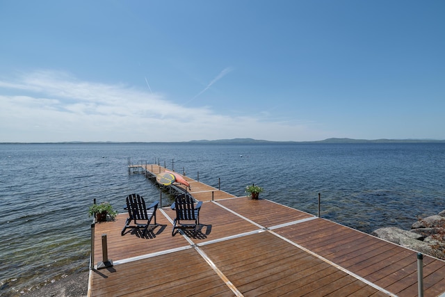 dock with a water and mountain view