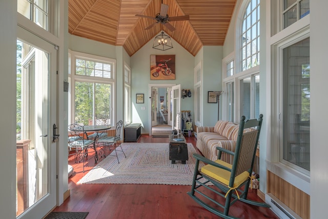 sunroom / solarium with high vaulted ceiling, healthy amount of natural light, wood ceiling, french doors, and wood finished floors