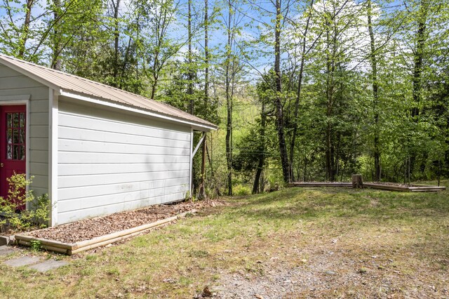 23 Woodland Rd, Winthrop, ME 04364 - view of grassy yard with an outbuilding