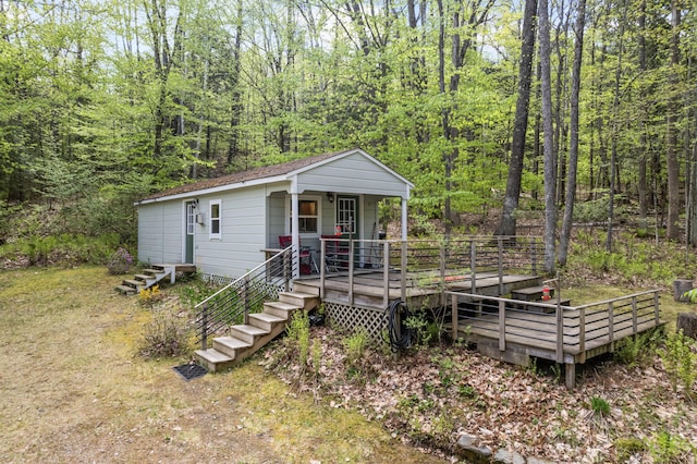 23 Woodland Rd, Winthrop, ME 04364 - view of front of property with a view of trees