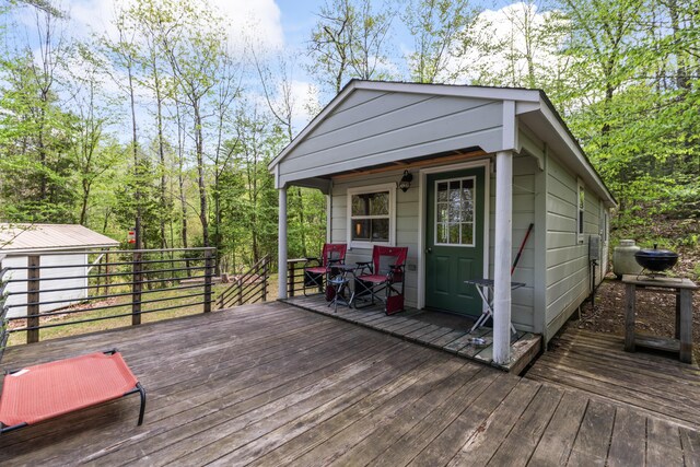 23 Woodland Rd, Winthrop, ME 04364 - wooden terrace featuring an outdoor structure