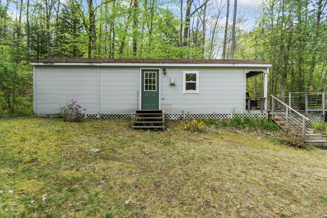23 Woodland Rd, Winthrop, ME 04364 - rear view of property with entry steps and a yard