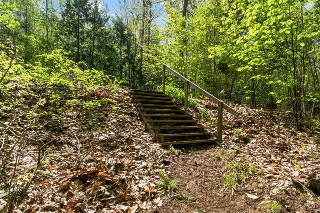 23 Woodland Rd, Winthrop, ME 04364 - exterior space featuring stairs and a forest view