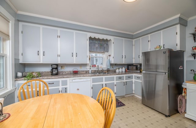 1 High St, Hallowell, ME 04347 - kitchen featuring freestanding refrigerator, a sink, dishwasher, light flooring, and ornamental molding