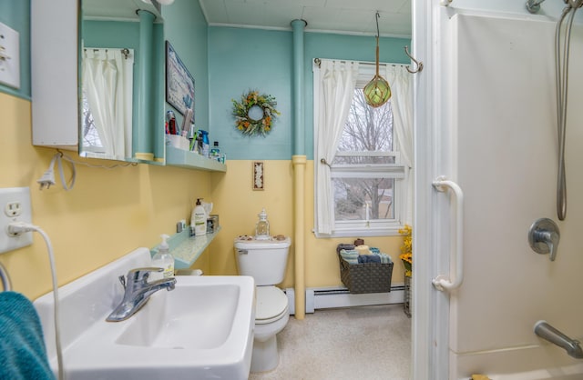 1 High St, Hallowell, ME 04347 - bathroom featuring a baseboard heating unit, a sink, a shower, and toilet