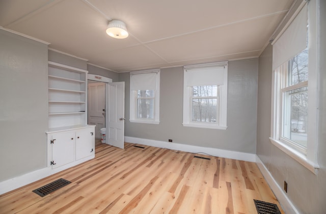 1 High St, Hallowell, ME 04347 - unfurnished bedroom featuring baseboards and light wood finished floors