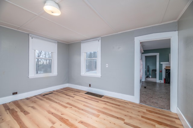 1 High St, Hallowell, ME 04347 - spare room featuring wood finished floors, a fireplace, and baseboards