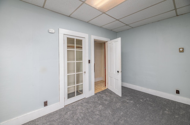 1 High St, Hallowell, ME 04347 - carpeted empty room featuring a paneled ceiling, baseboards, and a smoke detector