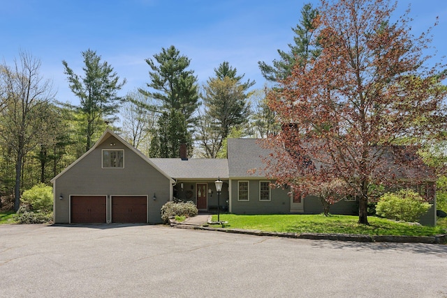 248 Morse Rd, Norway, ME 04268 - view of front of property featuring driveway, a chimney, an attached garage, and a front lawn