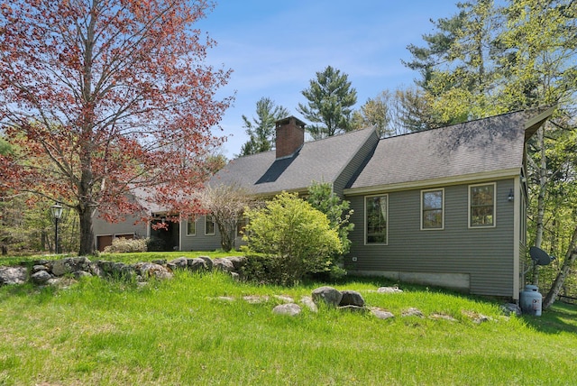 248 Morse Rd, Norway, ME 04268 - view of front of property with a chimney, roof with shingles, and a garage