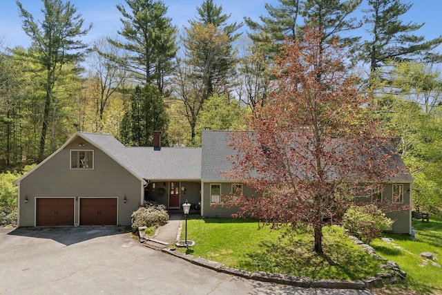 248 Morse Rd, Norway, ME 04268 - view of front of house featuring driveway, a front yard, a garage, and a chimney