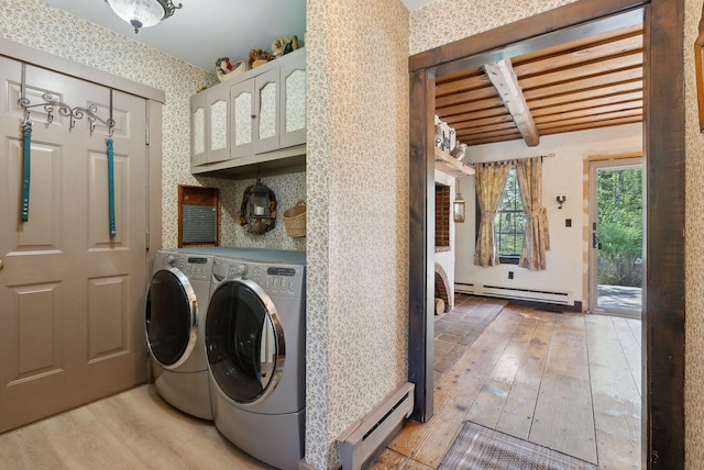 248 Morse Rd, Norway, ME 04268 - laundry room featuring baseboard heating, washer and dryer, a baseboard radiator, light wood-type flooring, and wallpapered walls