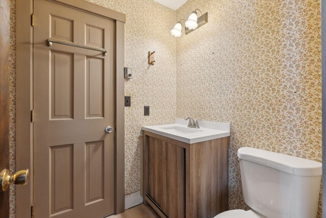248 Morse Rd, Norway, ME 04268 - half bath with toilet, wallpapered walls, and vanity