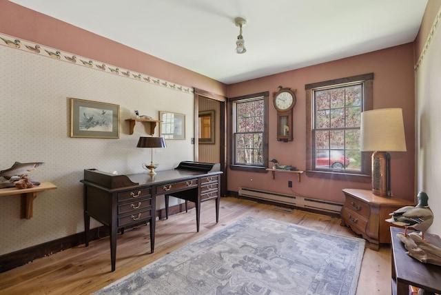 248 Morse Rd, Norway, ME 04268 - home office featuring a baseboard heating unit, light wood-style flooring, and baseboards
