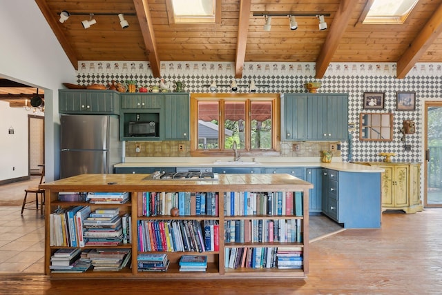 248 Morse Rd, Norway, ME 04268 - kitchen featuring track lighting, wooden ceiling, a sink, stainless steel appliances, and light countertops