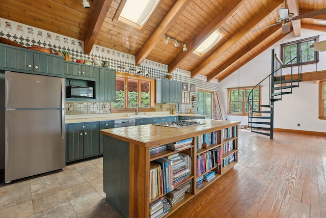 248 Morse Rd, Norway, ME 04268 - kitchen with appliances with stainless steel finishes, green cabinets, wood ceiling, a sink, and beam ceiling