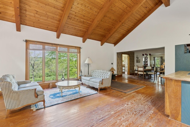 248 Morse Rd, Norway, ME 04268 - living room featuring wood-type flooring, high vaulted ceiling, beamed ceiling, and wood ceiling