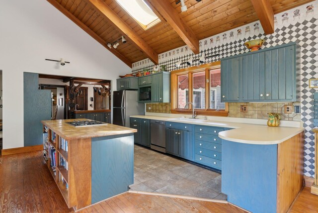 248 Morse Rd, Norway, ME 04268 - kitchen with appliances with stainless steel finishes, wooden ceiling, a sink, open shelves, and a center island