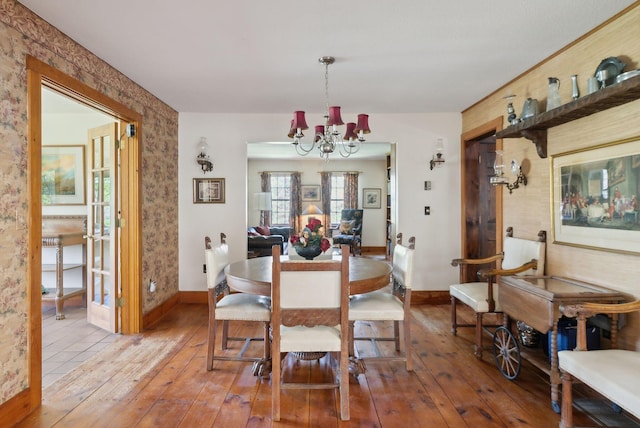 248 Morse Rd, Norway, ME 04268 - dining space featuring a chandelier, wood-type flooring, and baseboards