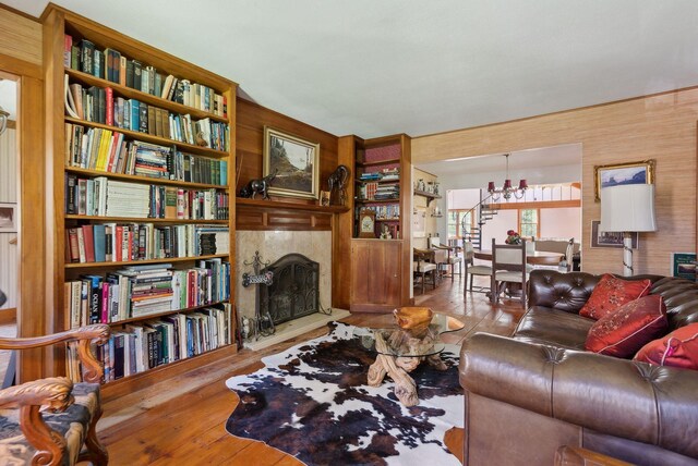 248 Morse Rd, Norway, ME 04268 - living area with a chandelier, hardwood / wood-style flooring, and a fireplace